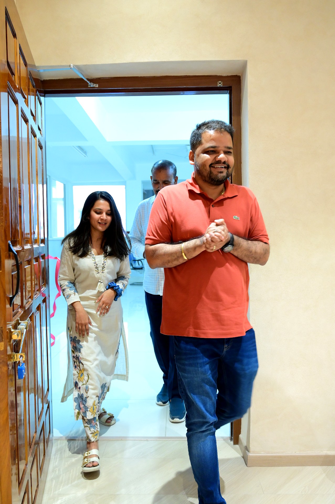 A client family walking into their newly handed-over Intange home